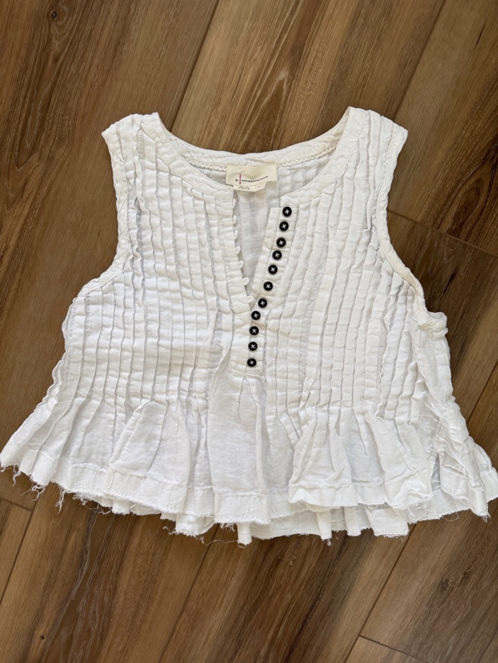 Anthropologie White Pintuck Ruffle-Hem Camisole with Black Button Placket